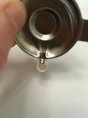 transferring beads into capsule from tray