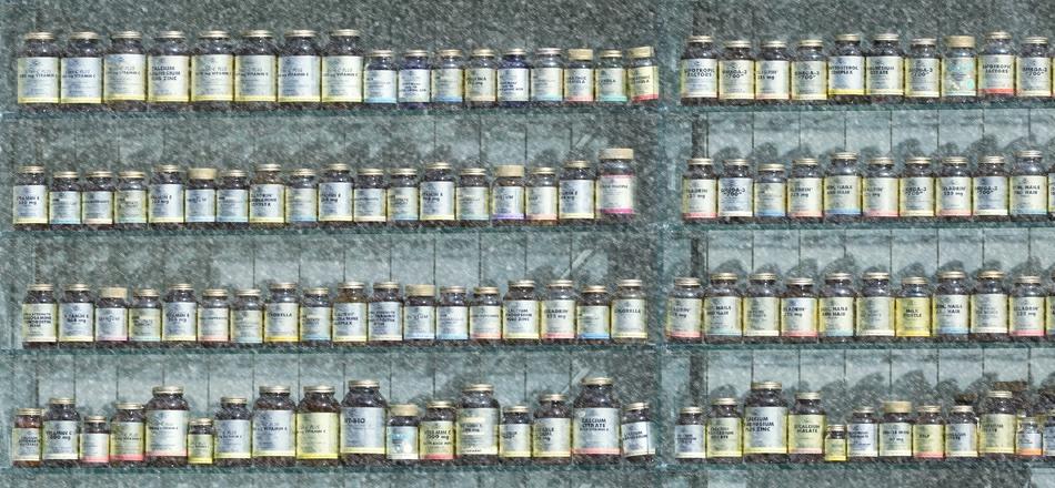 shelves with bottles of supplements